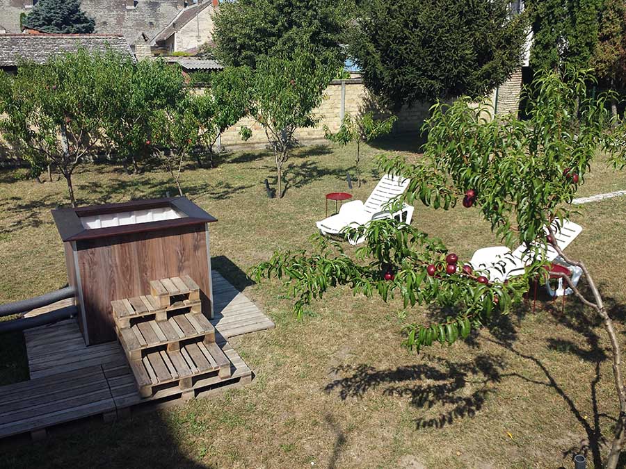 Private wood-fired hot tub in Subotica garden retreat