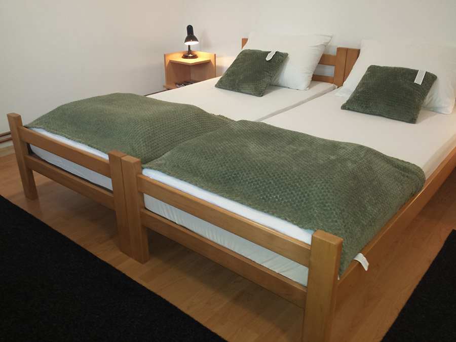 Warm interior of a private studio apartment with a cozy sleeping area in Subotica